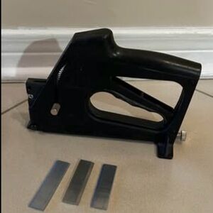 Gently used framing staple gun with some staples